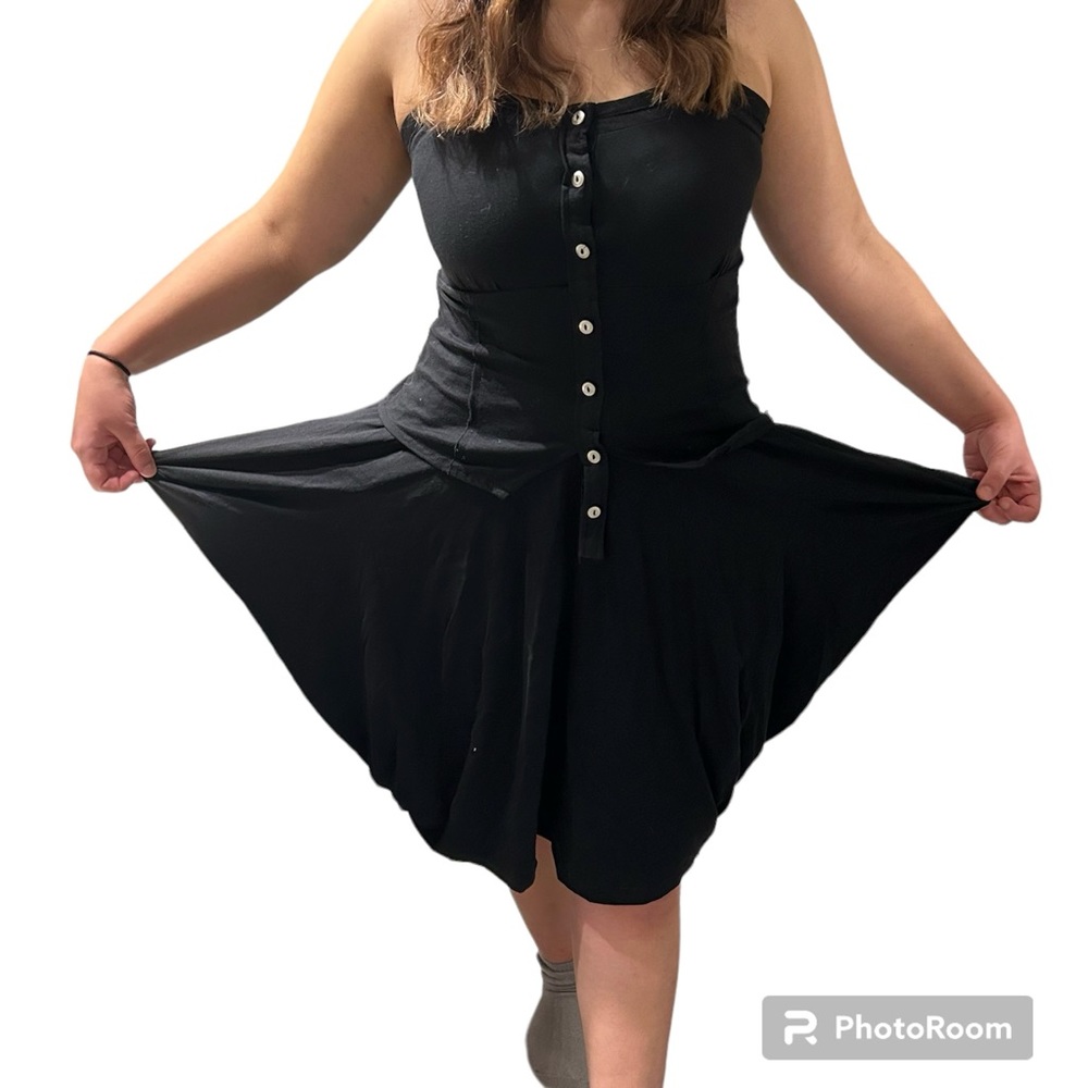 Black parachute pocket dress with silver buttons down the front.